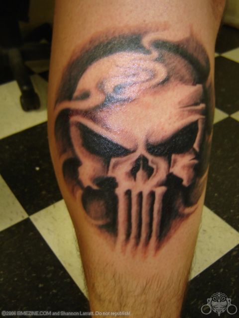 Black shaded punisher skull tattoo on sleeve for men