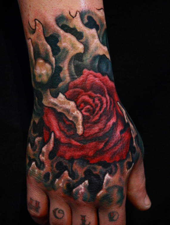 Colored rose tattoo on upper right hand