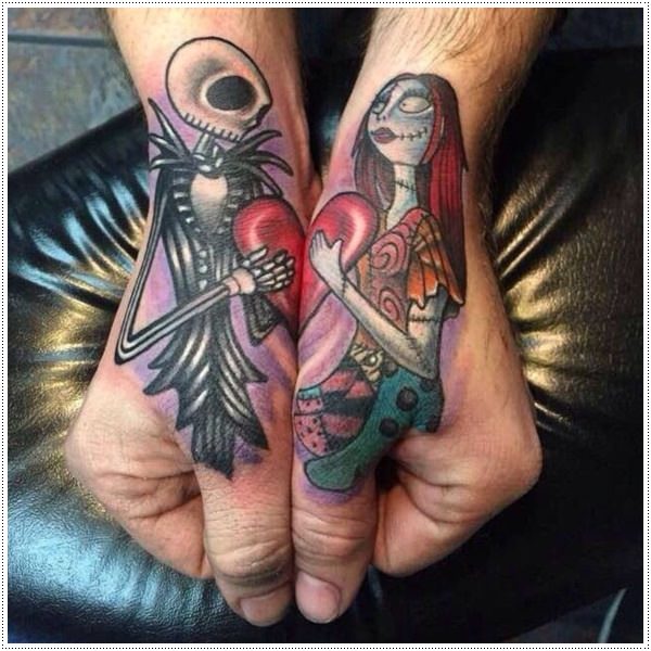 Colored skeletons with heart tattoo on both hands sides