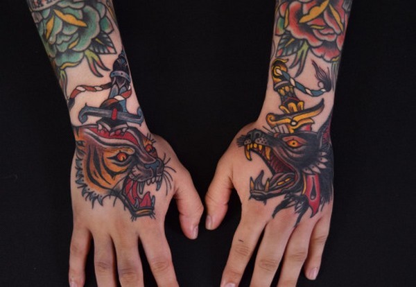 Colored wolf and cat tattoo on both upper hand