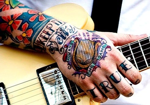 Colorful hand tattoo for men on right upper hand