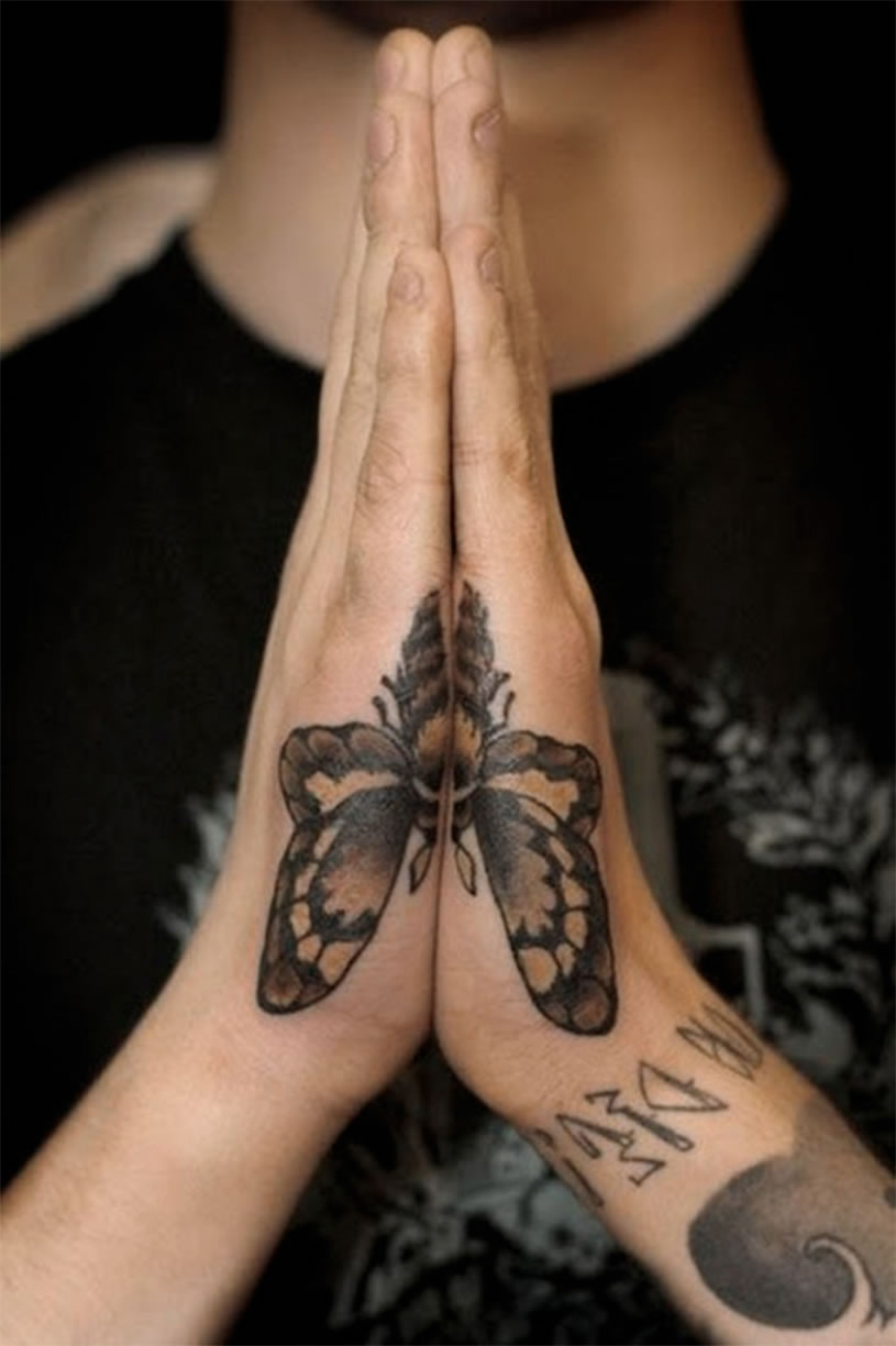 Grey Colored butterfly tattoo on hands