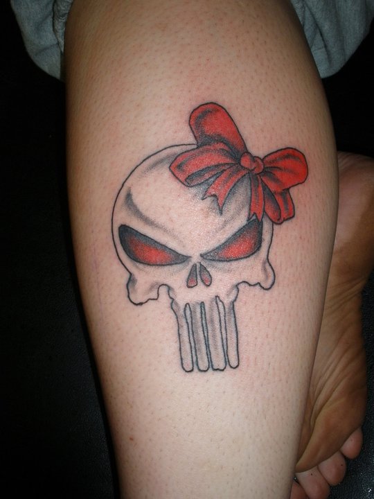 Grey and red punisher skull tattoo on leg for women by Therevolutiontattoos