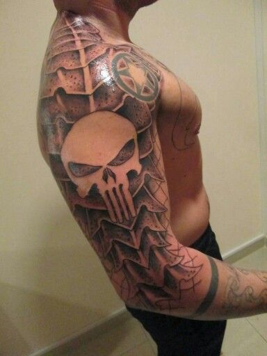 Grey punisher skull tattoo on right sleeve and shoulder for men