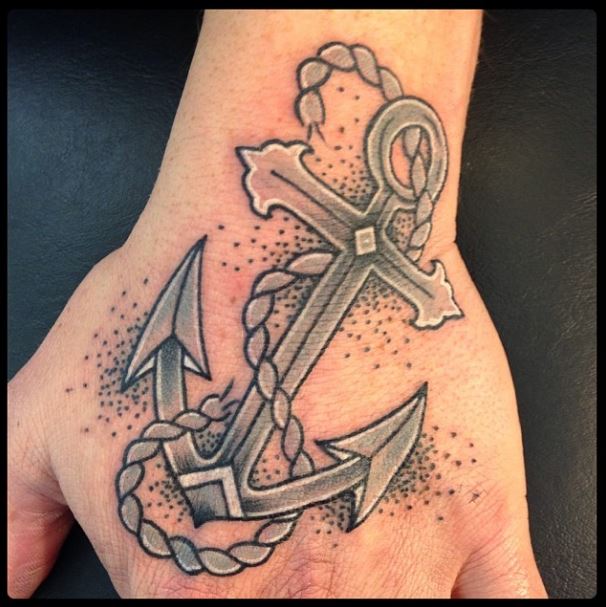 Grey shaded anchor and rope tattoo on upper hand