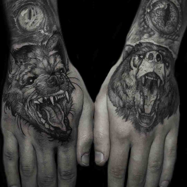 Grey shaded animal tattoo on upper hands by Rob Borbas