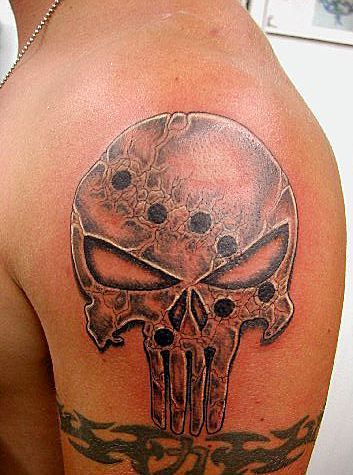 Grey shaded bullet holes punisher skull tattoo on left upper sleeve for men
