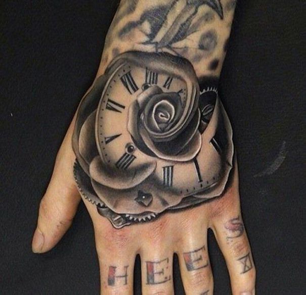 Grey shaded rose clock tattoo on upper right hand