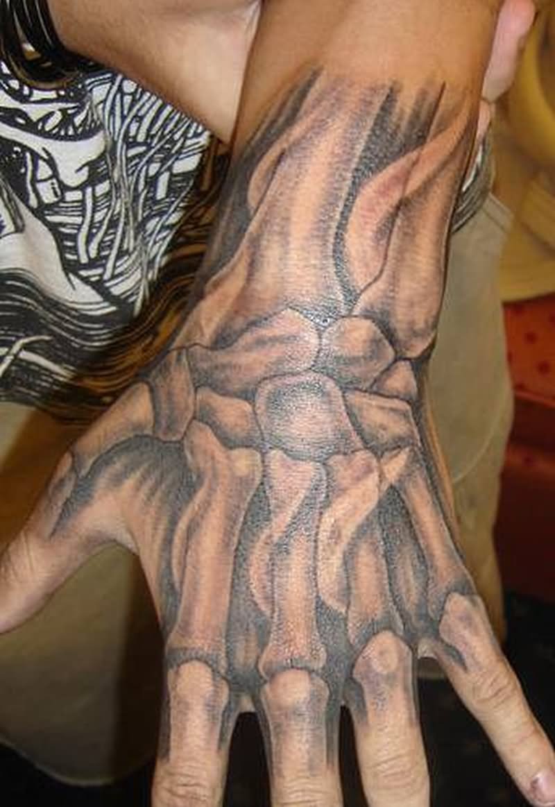 Grey shaded skeleton tattoo on full hand