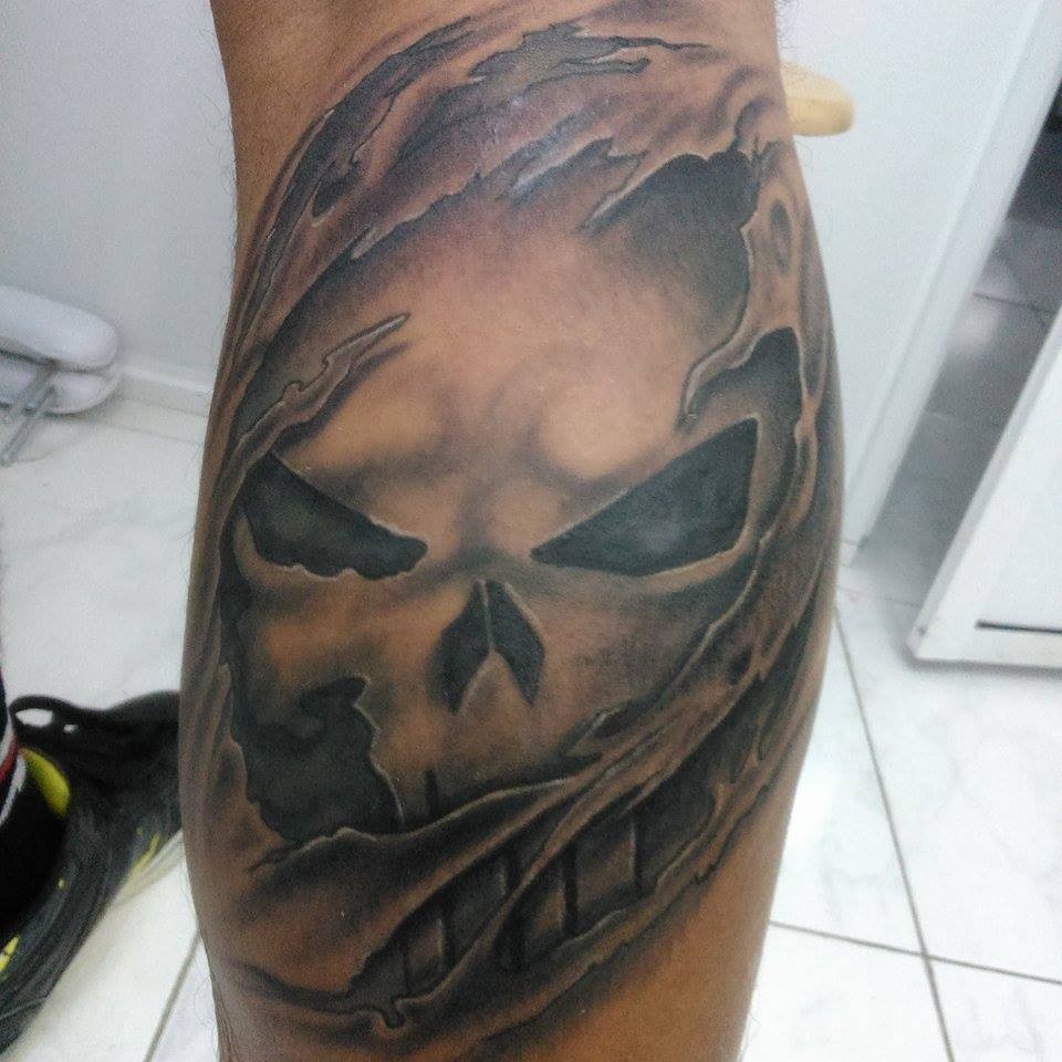 Grey shaded tear skin punisher tattoo on leg