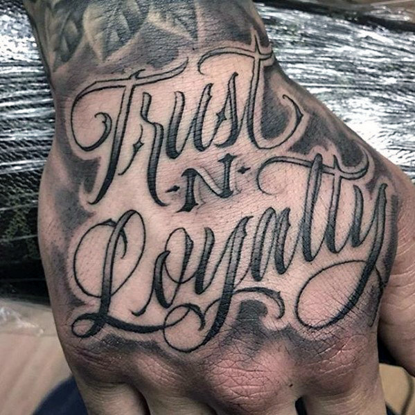 Grey shaded trust and loyalty tattoo on upper hand for men