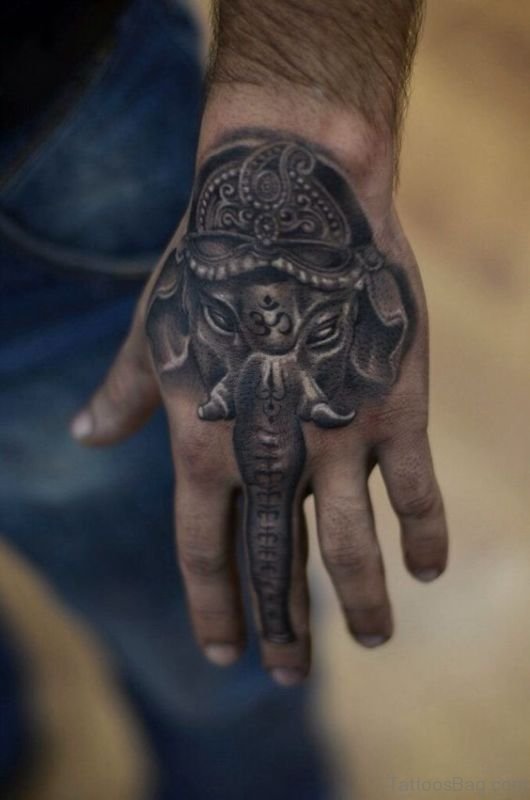 Grey shaded unique elephant tattoo on upper hand