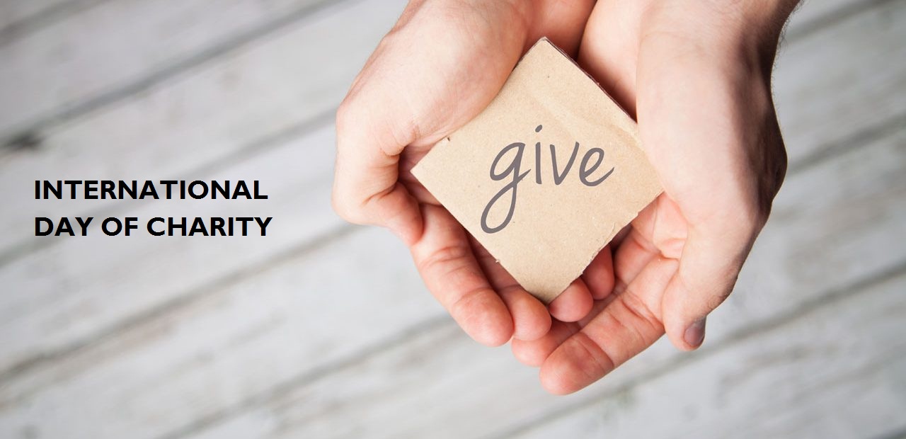 International Day of Charity give note in hands