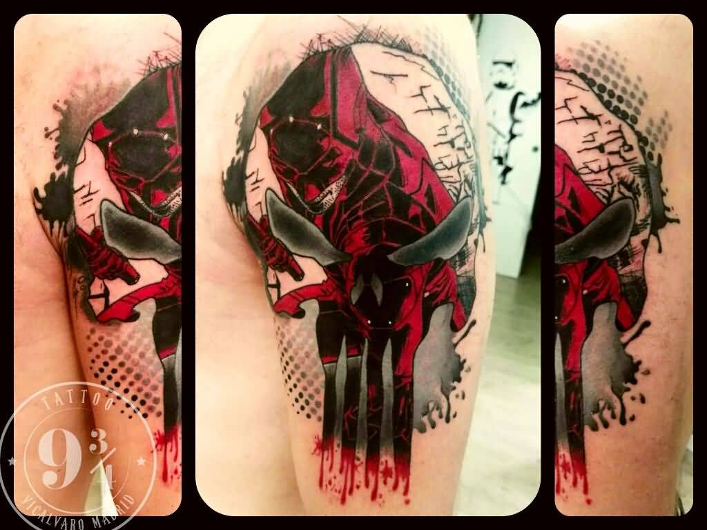 Red and grey punisher tattoo on left upper sleeve