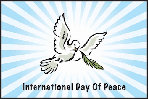 international day of peace flying dove with olive branch in mouth