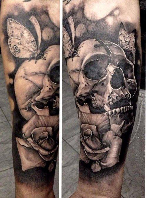 Black and grey shaded skull and roses tattoo on forearm for men