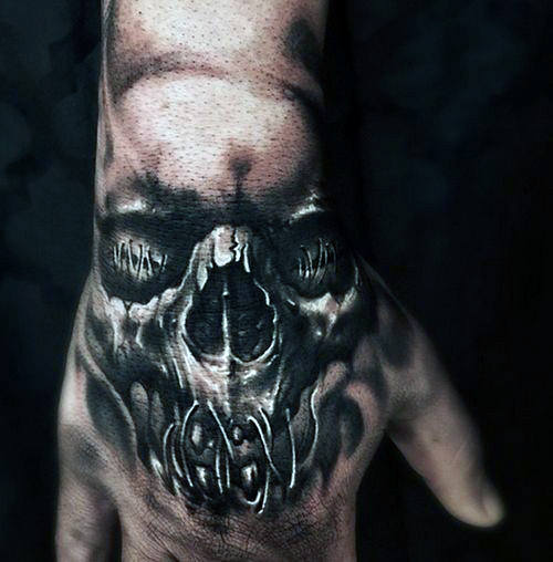Black and grey shaded skull on hand tattoo for men