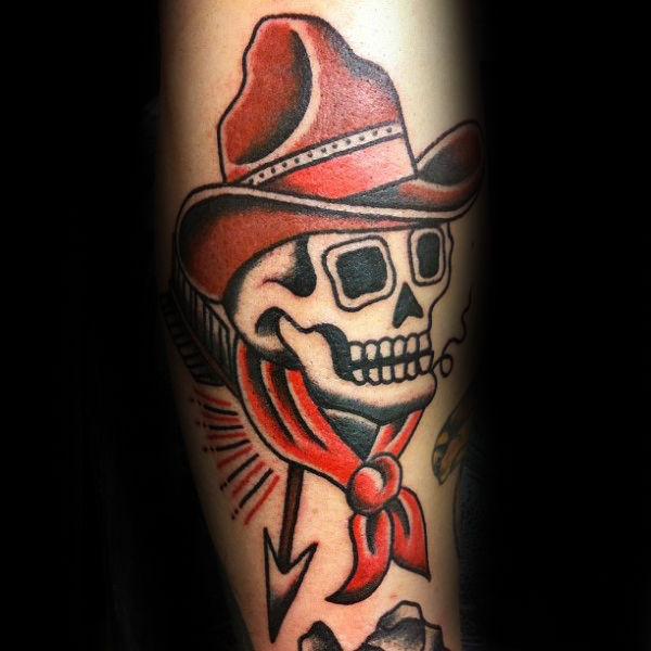 Black and red traditional skull tattoo on arm