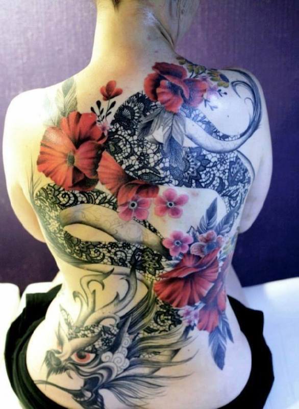 Black and red dragon snake tattoo with flowers on full back of woman
