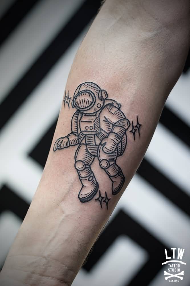 Black small geometric astronaut tattoo on right forearm