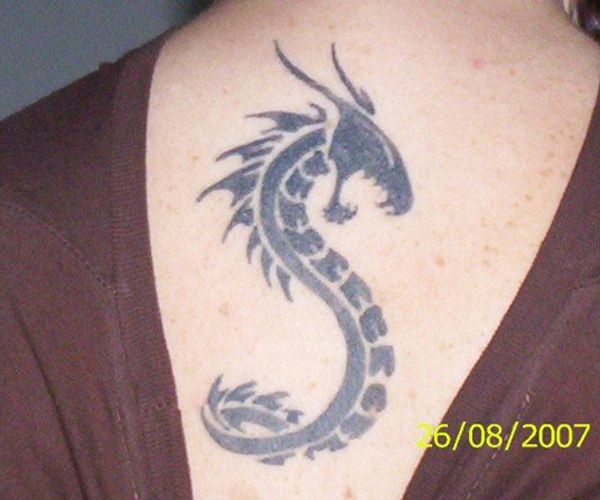 Black tribal Dragon snake tattoo on body