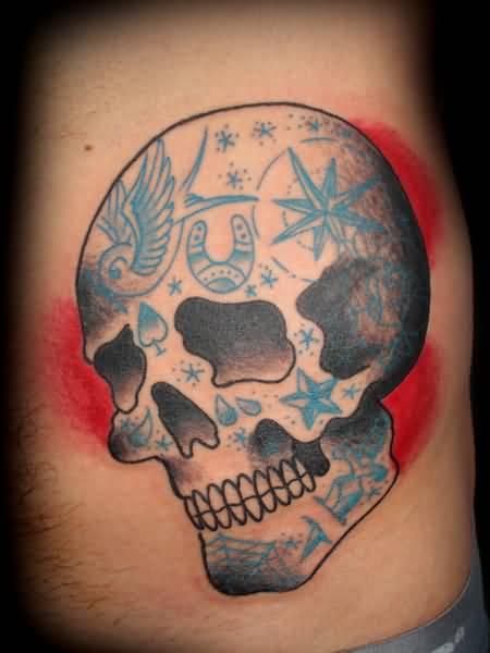 Blue and black printed traditional skull tattoo on body