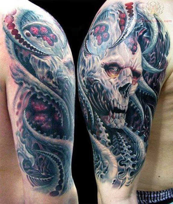 Blue shaded skull tattoo on upper sleeve