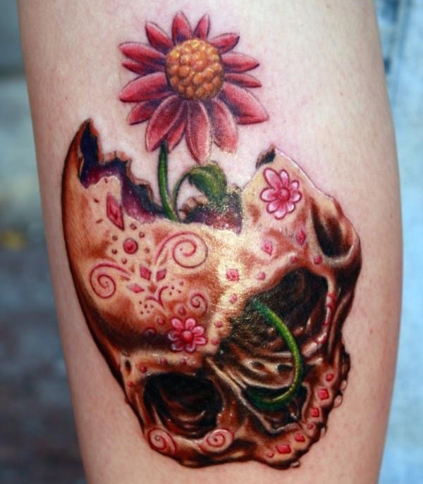 Colored slower from skull brain tattoo on body