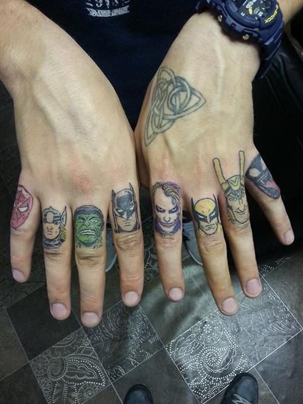 Colored superheroes knuckle tattoo