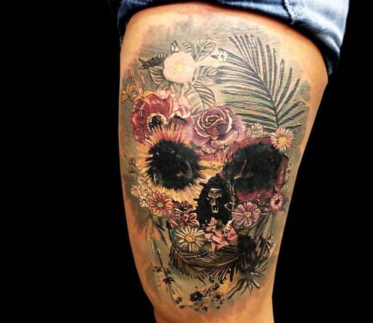 Colorful flower skull tattoo on body