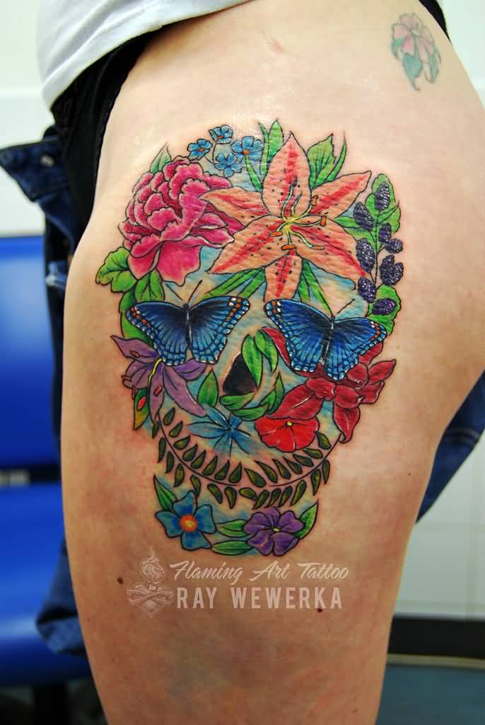 Colorful flower skull tattoo on left lower body