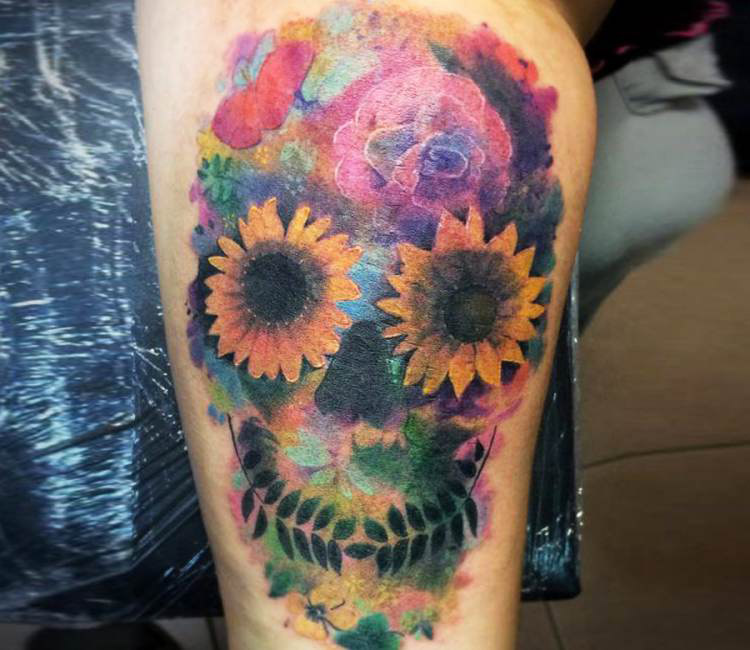 Colorful flower skull tattoo on sleeve