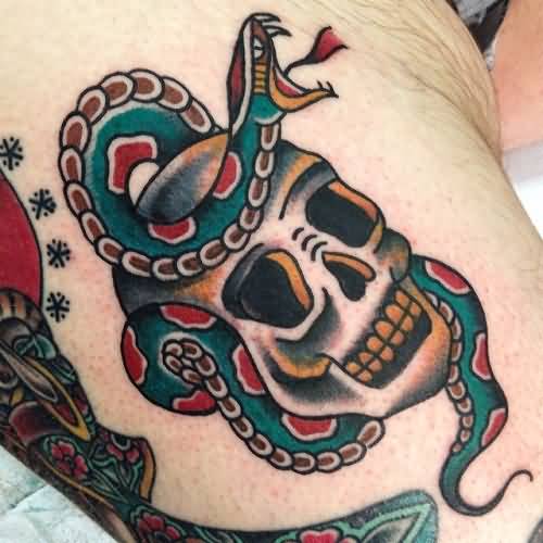 Colorful snake wrapped traditional skull tattoo on body
