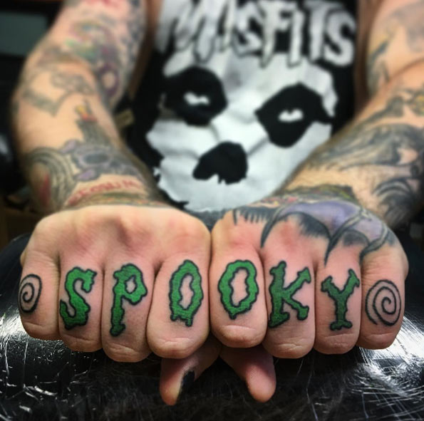 Green spooky wording knuckle tattoo for men