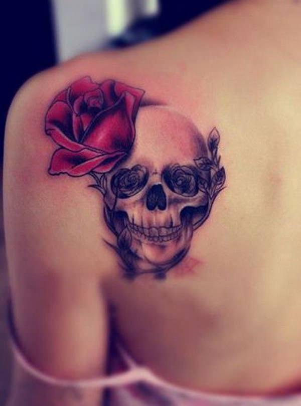 Grey and red shaded skull and rose tattoo on upper left back for women