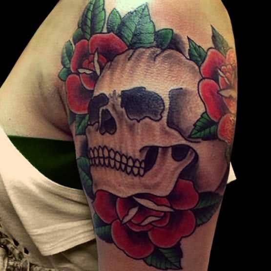Grey and red shaded skull and roses tattoo on upper left sleeve for women