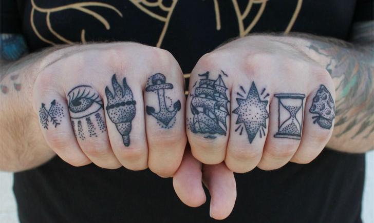Grey dotwork elements knuckle tattoo