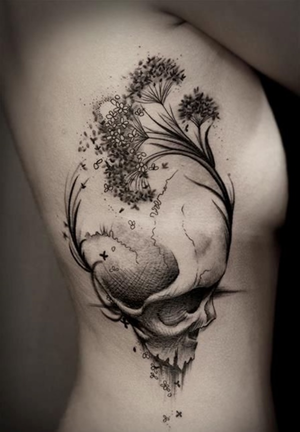 Grey shaded flower and skull tattoo on right upper body