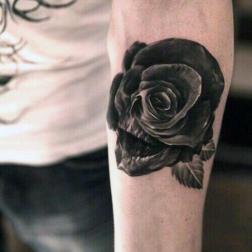 Grey shaded skull rose eye tattoo on arm
