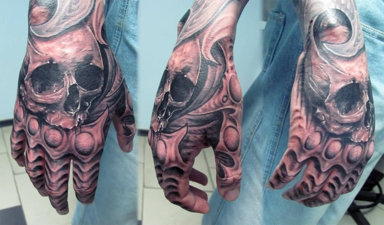 Grey shaded skull tattoo on full hand for men