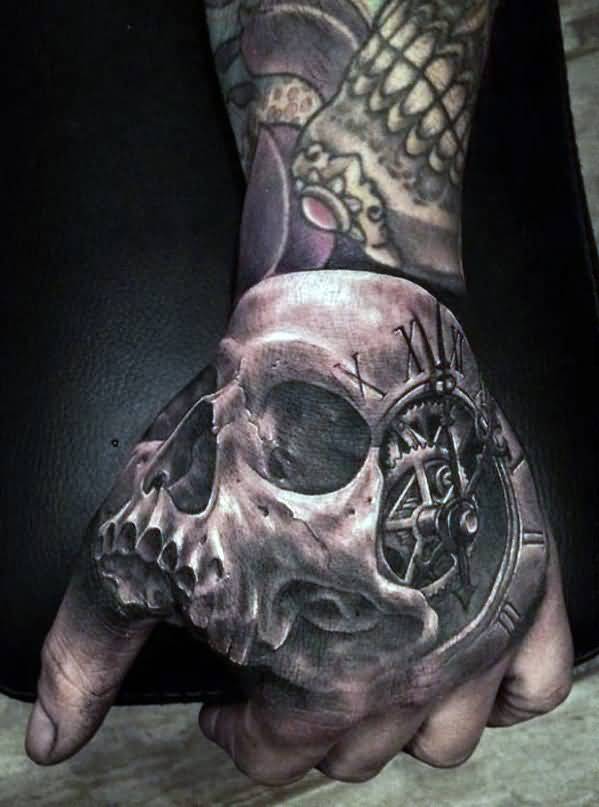 Grey shaded skull with clock tattoo on left hand for men
