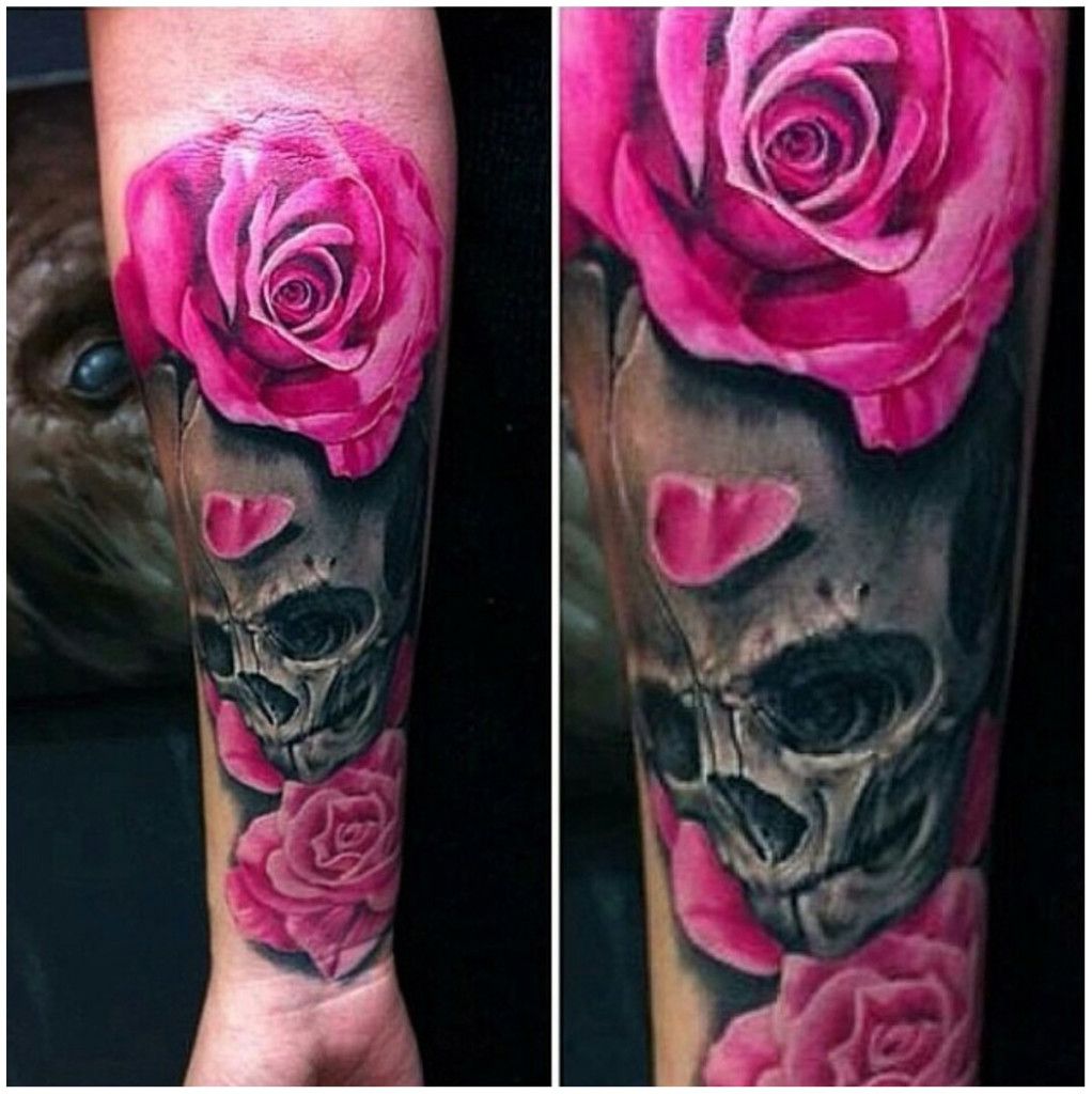 Pink and grey skull and roses tattoo on full forearm