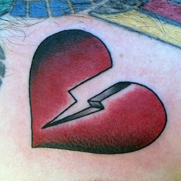 Red and black cracking from mid broken heart tattoo on chest for men