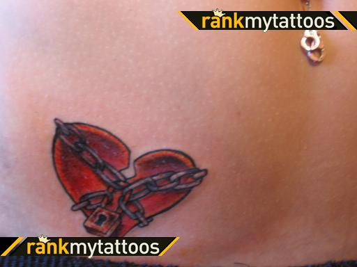 Red and grey broken heart with chain tattoo on body