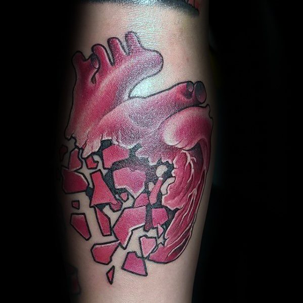 Red broken heart pieces tattoo on calf for men
