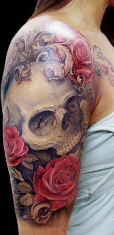 Red roses and grey shaded skull tattoo on upper sleeve for women