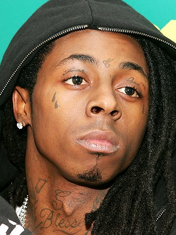 Black filled teardrop tattoo on left and right eye on Lil Wayne