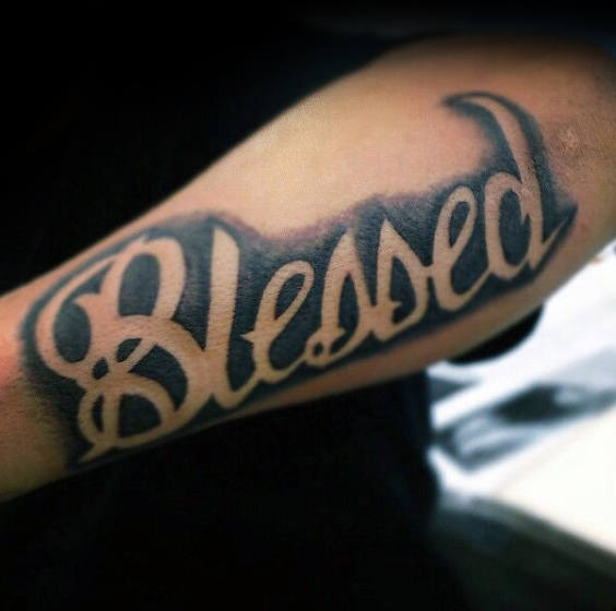 Black background simple blessed tattoo on forearm