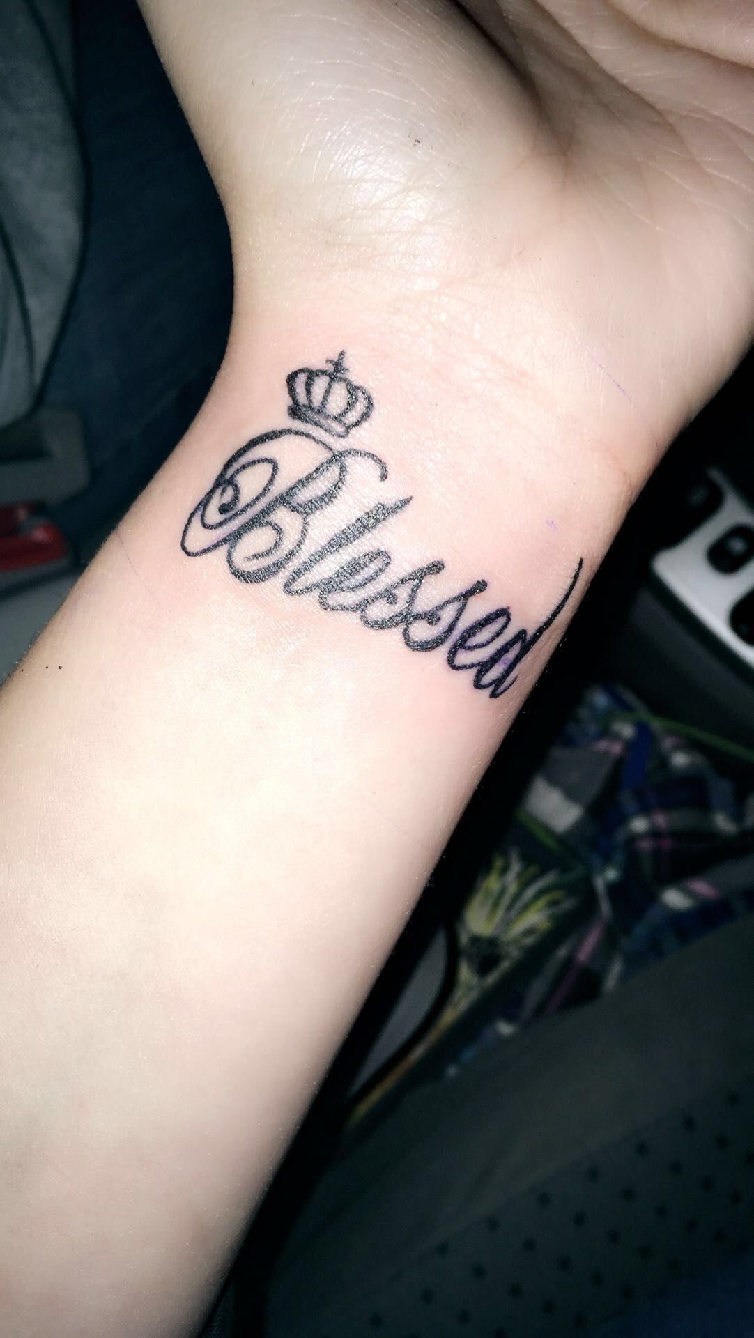 Black crown with blessed tattoo on inner wrist for women