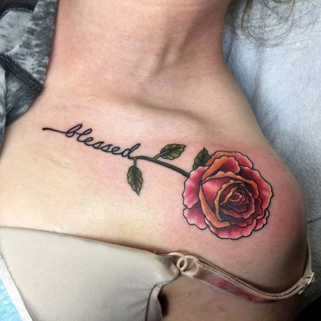 Red and green rose and blessed tattoo below left collar bone for women